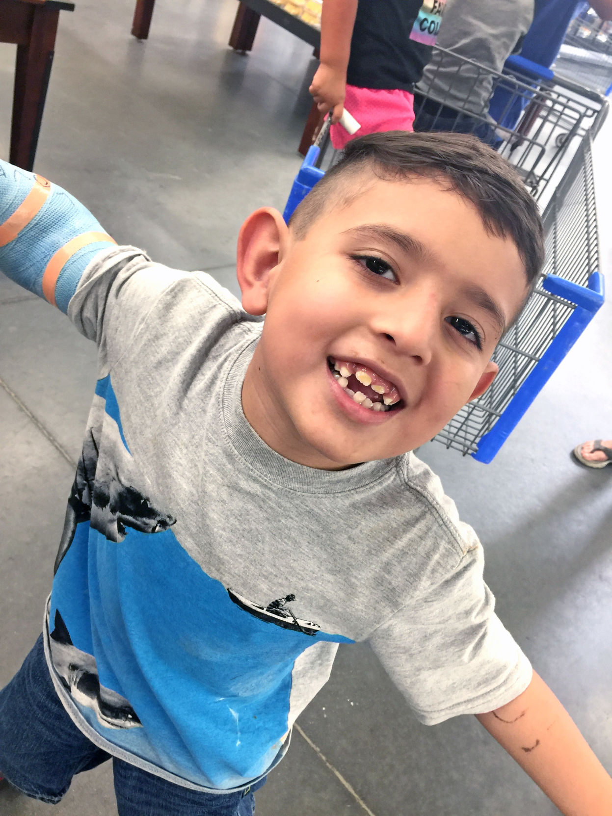 Car club hosts car wash for boy hit by stray bullet